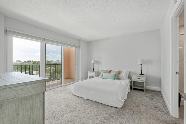 51 Island Way Unit 411, Clearwater Beach, FL 33767 - carpeted bedroom with access to outside and a textured ceiling