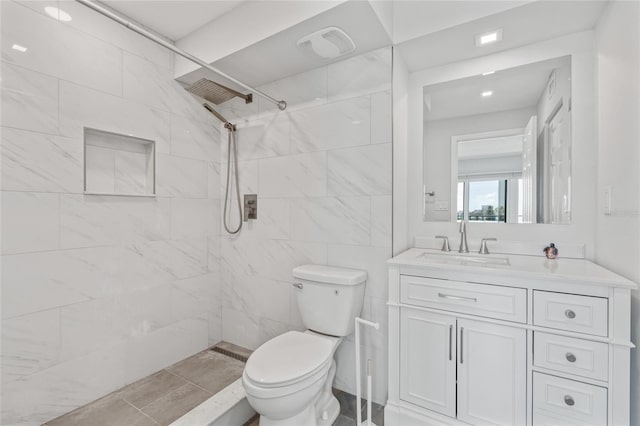 51 Island Way Unit 411, Clearwater Beach, FL 33767 - bathroom featuring a tile shower and vanity