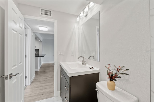 51 Island Way Unit 411, Clearwater Beach, FL 33767 - bathroom featuring toilet and vanity