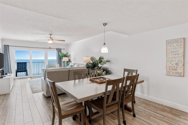 18500 Gulf Blvd Unit 503, Indian Shores, FL 33785 - dining space with a textured ceiling, light wood-style flooring, and ceiling fan