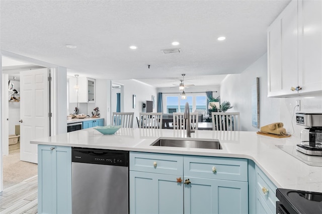 18500 Gulf Blvd Unit 503, Indian Shores, FL 33785 - kitchen with stainless steel dishwasher, light countertops, a peninsula, a ceiling fan, and recessed lighting