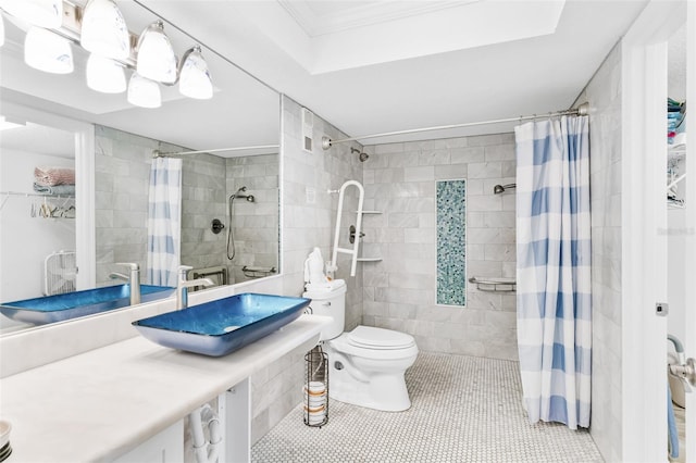 18500 Gulf Blvd Unit 503, Indian Shores, FL 33785 - full bathroom featuring tile walls, tile patterned floors, a tile shower, crown molding, and vanity
