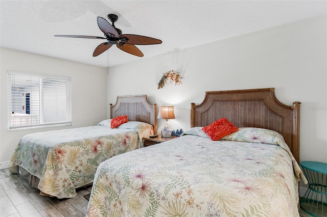 18500 Gulf Blvd Unit 503, Indian Shores, FL 33785 - bedroom with wood finished floors and a ceiling fan