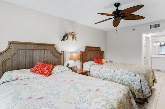 18500 Gulf Blvd Unit 503, Indian Shores, FL 33785 - bedroom featuring ensuite bathroom and ceiling fan