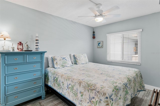 18500 Gulf Blvd Unit 503, Indian Shores, FL 33785 - bedroom with wood finished floors and ceiling fan