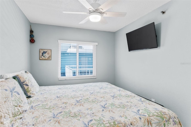 18500 Gulf Blvd Unit 503, Indian Shores, FL 33785 - bedroom with a ceiling fan and a textured ceiling