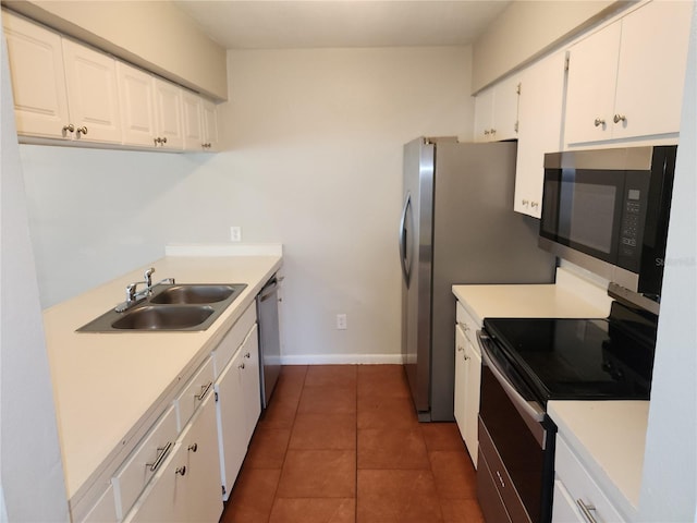 4009 Forecast Dr, Brandon, FL 33511 - kitchen with appliances with stainless steel finishes, white cabinets, and light countertops
