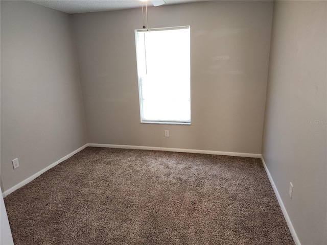 4009 Forecast Dr, Brandon, FL 33511 - carpeted spare room with baseboards and ceiling fan
