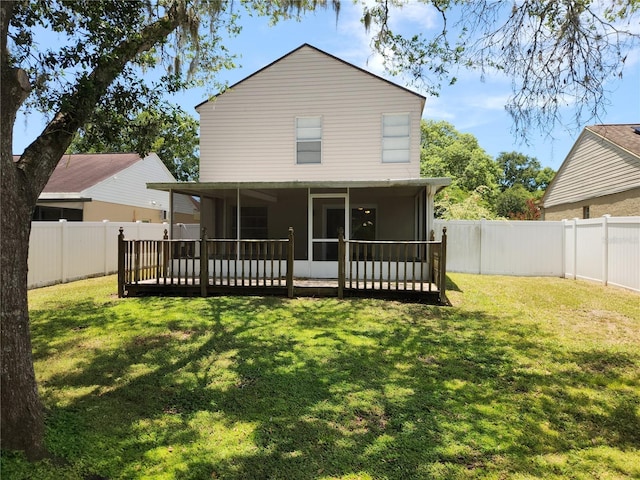 4009 Forecast Dr, Brandon, FL 33511 - rear view of house featuring a sunroom and a fenced backyard