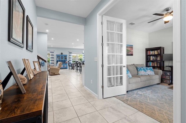 10618 Daybreak Gln, Parrish, FL 34219 - living room with light tile patterned floors, ceiling fan, and recessed lighting
