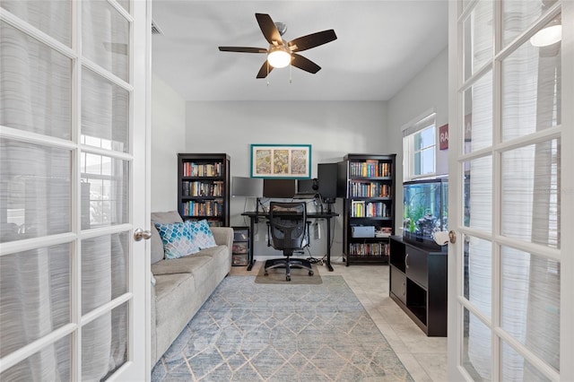 10618 Daybreak Gln, Parrish, FL 34219 - office area with french doors, a ceiling fan, and light tile patterned floors