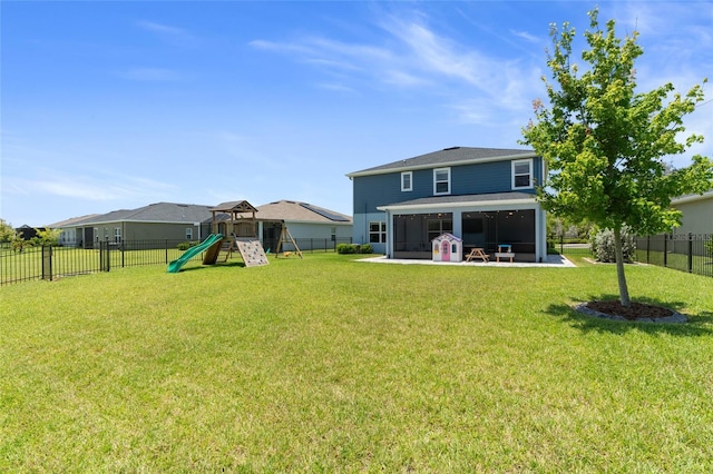 10618 Daybreak Gln, Parrish, FL 34219 - rear view of property with a sunroom, a fenced backyard, and a playground