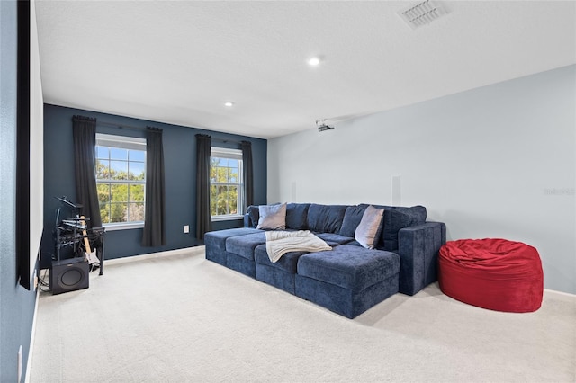 10618 Daybreak Gln, Parrish, FL 34219 - carpeted living room featuring baseboards and recessed lighting