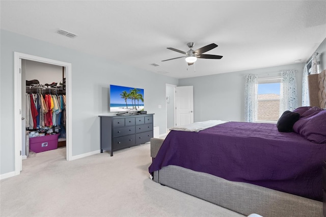 10618 Daybreak Gln, Parrish, FL 34219 - bedroom featuring light carpet, a walk in closet, and a ceiling fan