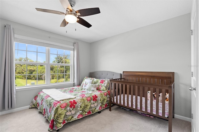 10618 Daybreak Gln, Parrish, FL 34219 - carpeted bedroom featuring baseboards and a ceiling fan
