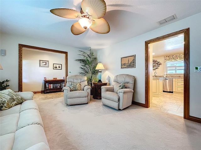 11141 Carla Dr, Largo, FL 33774 - living room with light carpet and ceiling fan