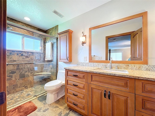 11141 Carla Dr, Largo, FL 33774 - bathroom with vanity, a stall shower, and a textured ceiling