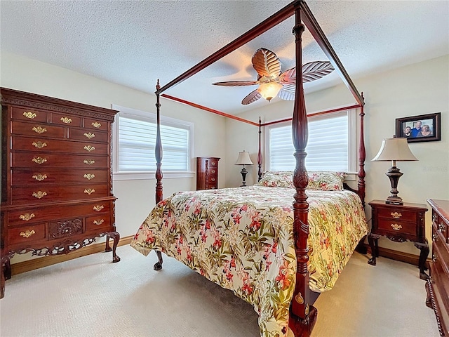 11141 Carla Dr, Largo, FL 33774 - bedroom with carpet flooring, a ceiling fan, and a textured ceiling