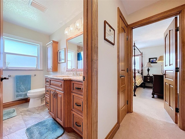 11141 Carla Dr, Largo, FL 33774 - full bath with ensuite bathroom, vanity, and a textured ceiling