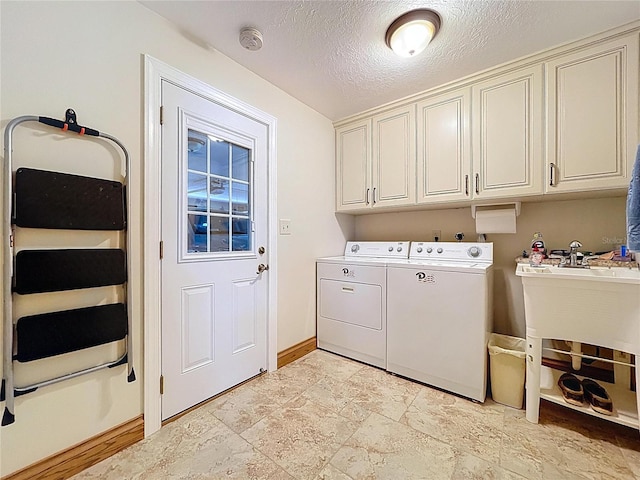 11141 Carla Dr, Largo, FL 33774 - laundry room with washing machine and dryer, cabinet space, a textured ceiling, and light stone finish floors