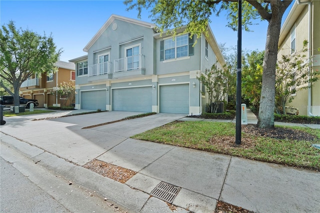 6734 Breezy Palm Dr, Riverview, FL 33578 - view of property with stucco siding, an attached garage, and driveway