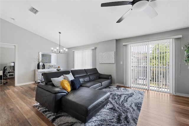 6734 Breezy Palm Dr, Riverview, FL 33578 - living room with wood finished floors, a chandelier, vaulted ceiling, and ceiling fan
