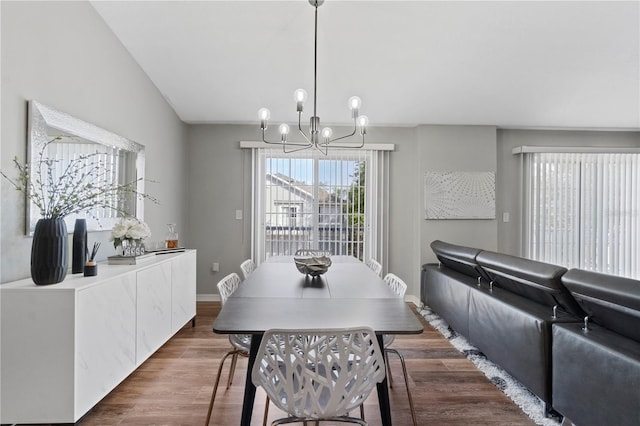 6734 Breezy Palm Dr, Riverview, FL 33578 - dining area with a chandelier and dark wood-style flooring