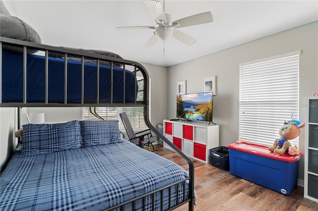 6734 Breezy Palm Dr, Riverview, FL 33578 - bedroom featuring wood finished floors and a ceiling fan
