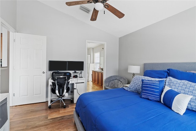 6734 Breezy Palm Dr, Riverview, FL 33578 - bedroom with vaulted ceiling, a desk, light wood-style flooring, and ceiling fan