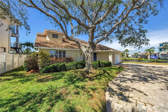 17601 Sterling Ter, Redington Shores, FL 33708 - view of front of property featuring driveway, stucco siding, and an attached garage