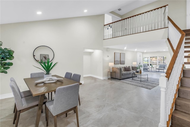 17601 Sterling Ter, Redington Shores, FL 33708 - dining area featuring stairway, recessed lighting, and a high ceiling