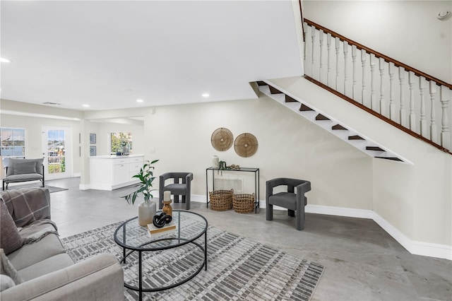 17601 Sterling Ter, Redington Shores, FL 33708 - living area featuring recessed lighting, stairs, and concrete floors
