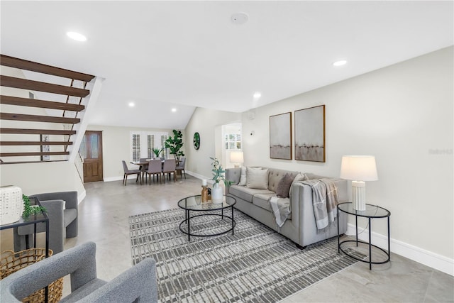 17601 Sterling Ter, Redington Shores, FL 33708 - living room with stairway, recessed lighting, finished concrete floors, and lofted ceiling