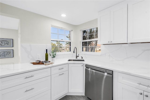 17601 Sterling Ter, Redington Shores, FL 33708 - kitchen featuring dishwasher, white cabinets, light stone countertops, and recessed lighting