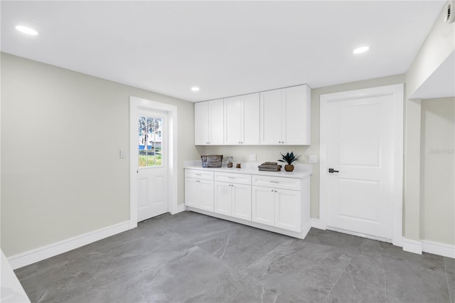 17601 Sterling Ter, Redington Shores, FL 33708 - kitchen featuring white cabinets, light countertops, and recessed lighting