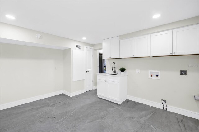 17601 Sterling Ter, Redington Shores, FL 33708 - washroom with washer hookup, electric dryer hookup, cabinet space, and recessed lighting