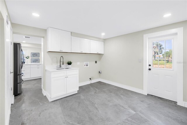 17601 Sterling Ter, Redington Shores, FL 33708 - laundry area featuring hookup for a washing machine, recessed lighting, hookup for a gas dryer, cabinet space, and electric dryer hookup