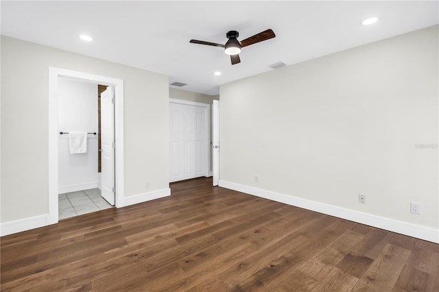 17601 Sterling Ter, Redington Shores, FL 33708 - unfurnished bedroom featuring wood finished floors, recessed lighting, ensuite bath, and a ceiling fan