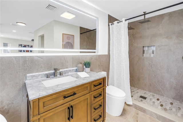 17601 Sterling Ter, Redington Shores, FL 33708 - full bath featuring tile walls, vanity, and tiled shower