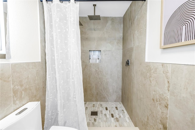 17601 Sterling Ter, Redington Shores, FL 33708 - full bathroom featuring tile walls and a tile shower