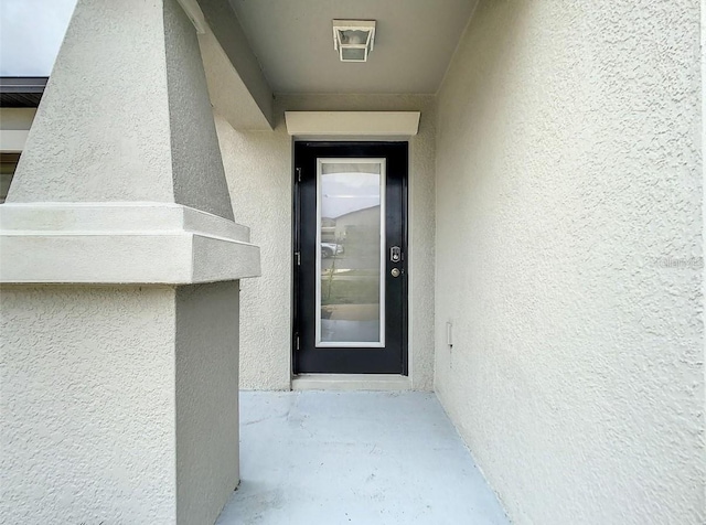 4282 Salt Springs Ln, Lakeland, FL 33811 - doorway to property with stucco siding
