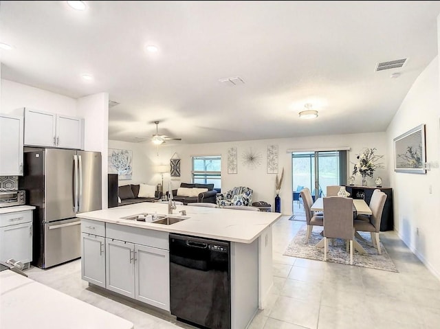 4282 Salt Springs Ln, Lakeland, FL 33811 - kitchen featuring dishwasher, freestanding refrigerator, open floor plan, plenty of natural light, and recessed lighting
