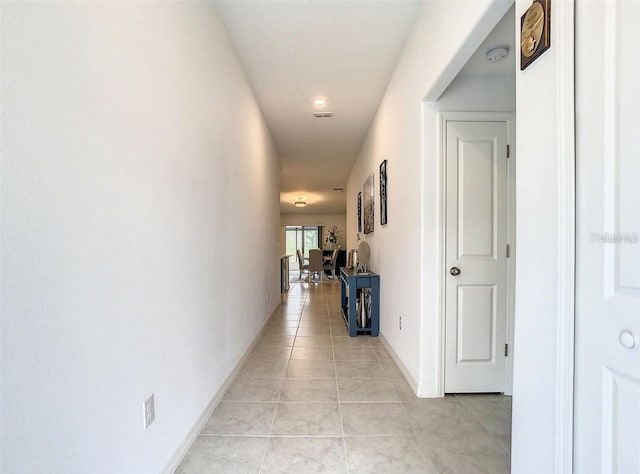 4282 Salt Springs Ln, Lakeland, FL 33811 - hall featuring light tile patterned floors and baseboards