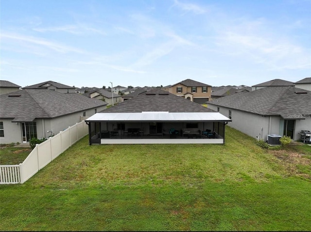 4282 Salt Springs Ln, Lakeland, FL 33811 - rear view of house with a sunroom, a residential view, a fenced backyard, and roof with shingles