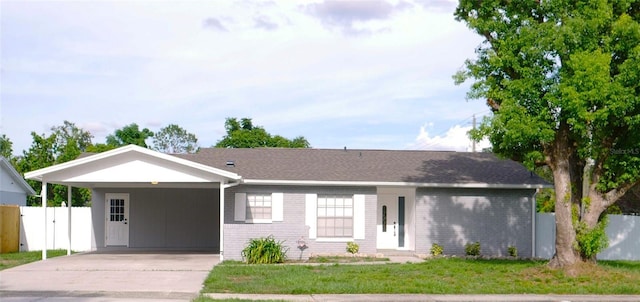 1302 Highview Rd, Brandon, FL 33510 - single story home featuring an attached carport, driveway, and brick siding