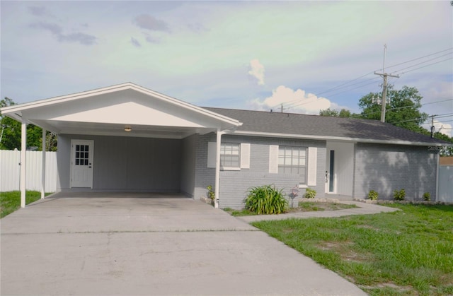 1302 Highview Rd, Brandon, FL 33510 - single story home featuring brick siding, concrete driveway, and an attached carport