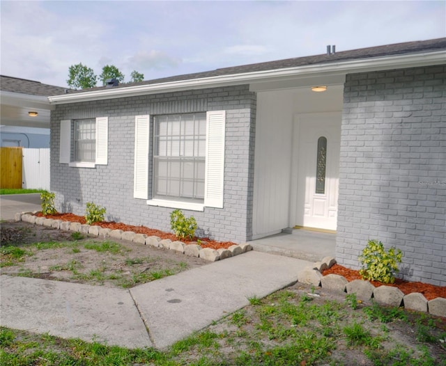 1302 Highview Rd, Brandon, FL 33510 - doorway to property featuring brick siding