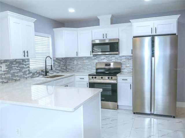 1302 Highview Rd, Brandon, FL 33510 - kitchen featuring appliances with stainless steel finishes, light marble finish floors, white cabinets, light stone countertops, and recessed lighting