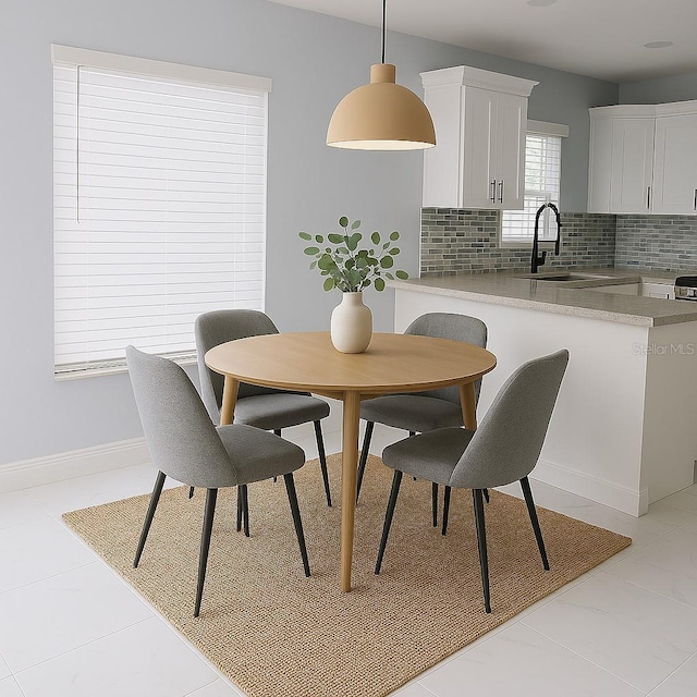 1302 Highview Rd, Brandon, FL 33510 - dining room featuring baseboards