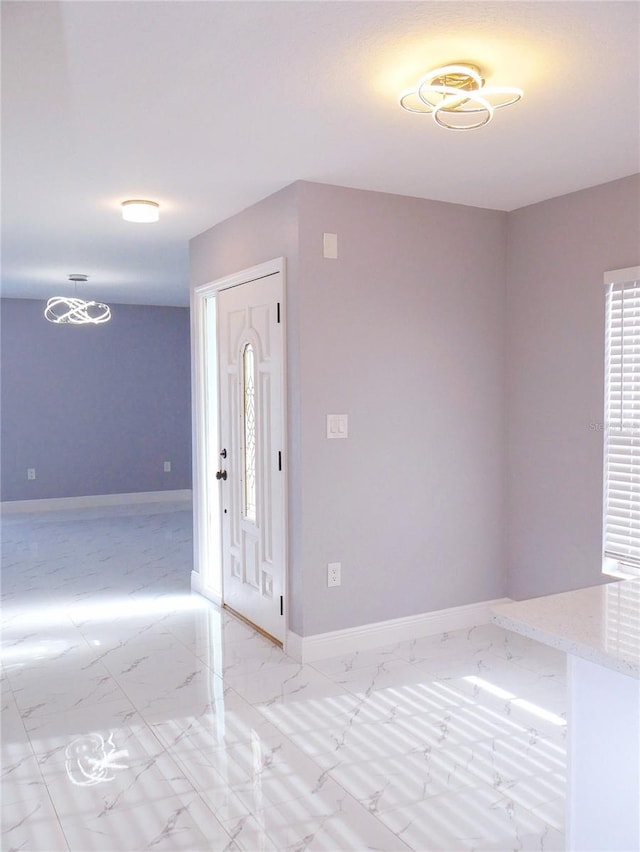 1302 Highview Rd, Brandon, FL 33510 - foyer entrance featuring light marble finish flooring and baseboards